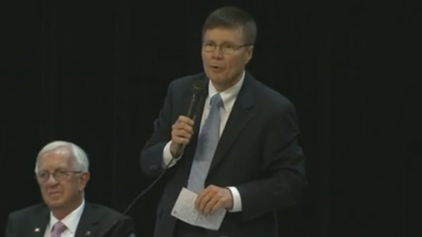 Moore County NC School Superintendent Robert Grimesey addresses the audience after the board voted to give him his job back