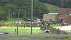 Students flee from Barbour High School in Philippi, W.Va., after an armed student allegedly held a teacher and classmates hostage in a classroom.