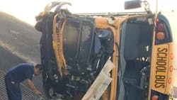 An investigator examines the damage from a fatal school bus crash in Houston An investigator examines the damage from a fatal school bus crash in Houston