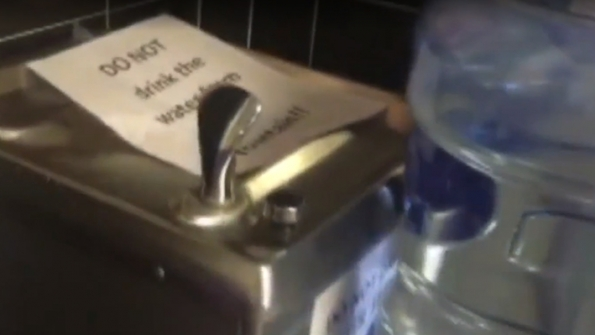 A sign atop a turnedoff drinking fountain in a Newark NJ school warns students not to drink the water