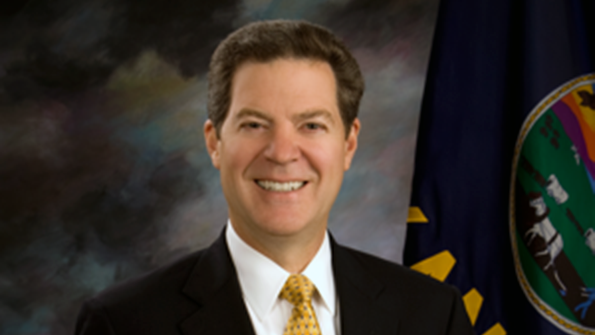 Kansas Gov Sam Brownback has signed a school funding bill
