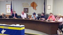 Under threat of state takeover, the Boone Couny (W.Va.) board approved a budget.