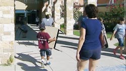 Volunteers help haul desks and other equipment back to Shields Elementary School Volunteers help haul desks and other equipment back to Shields Elementary School
