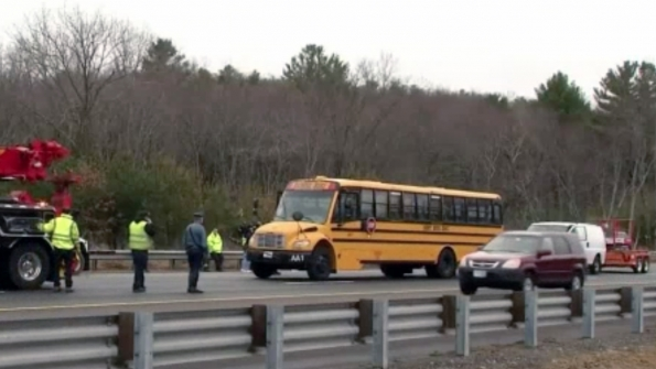 Authorities are investigating a school bus crash in Bedford Mass that caused minor injuries to 23 students