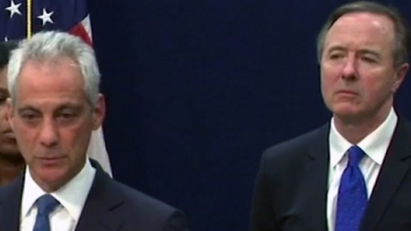 As Chicago Schools CEO Forrest Claypool right looks on Mayor Rahm Emanuel announces that city schools will not have to cut short its academic year