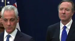 As Chicago Schools CEO Forrest Claypool right looks on Mayor Rahm Emanuel announces that city schools will not have to cut short its academic year