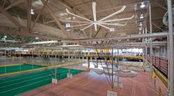 Iowa State University solved comfort and IAQ issues resulting from stagnant hot air with a natural ventilation approach by installing 10 ceiling fans of various sizes around the upper indoor track in its recreation facility. Photo: Big Ass Fans