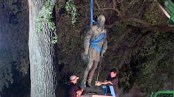 Worker remove Confederate statues from the University of Texas campus in Austin.