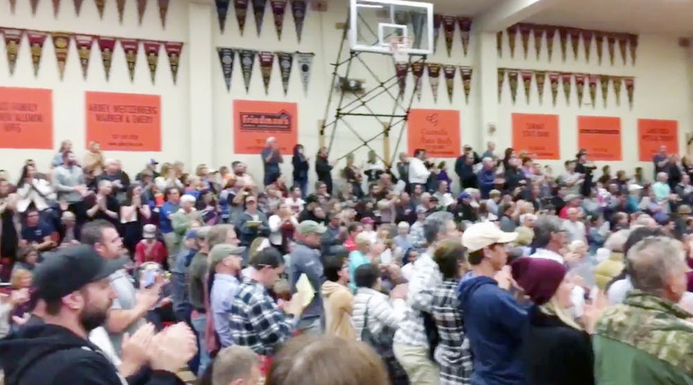 Santa Rosa residents attending a town hall at Santa Rosa High School give a standing ovation to firefighters.