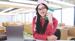 Student dressed warmly in library
