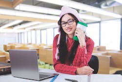 Student dressed warmly in library Student dressed warmly in library