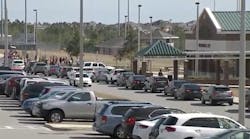 Cars line up outside the entrance to Lake Minneola High School.