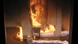 This photograph is from a commissioned test of HDPE untreated panels conducted by an independent laboratory using the NFPA 286 roomcorner test The photo shows the HDPE panels being tested as they would be installed as toilet partitions in the field Note the resulting flammable liquids fire on the floor and flammable liquids ldquoflowrdquo on the panels This photograph is from a commissioned test of HDPE untreated panels conducted by an independent laboratory using the NFPA 286 roomcorner test The photo shows the HDPE panels being tested as they would be installed as toilet partitions in the field Note the resulting flammable liquids fire on the floor and flammable liquids ldquoflowrdquo on the panels