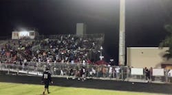 Fans leave the stadium after gunshots ring out at Palm Beach Central High.