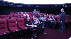 Marc Horowitz, planetarium director and head of the Edward R. Murrow High School astronomy program, speaks to students about the renovations made to the school&apos;s planetarium.
