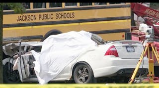 One person died when a car and school bus collided in Jackson, Mich.