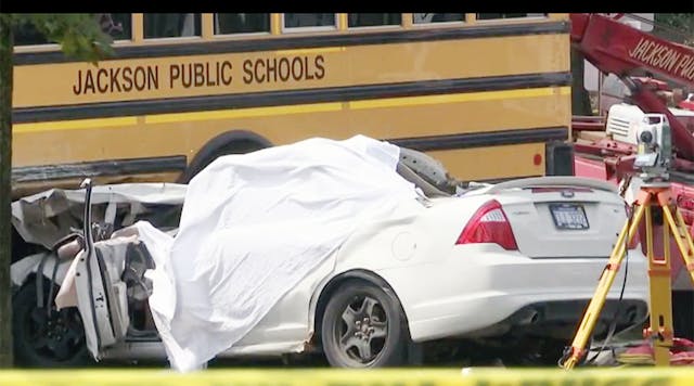 One person died when a car and school bus collided in Jackson, Mich.