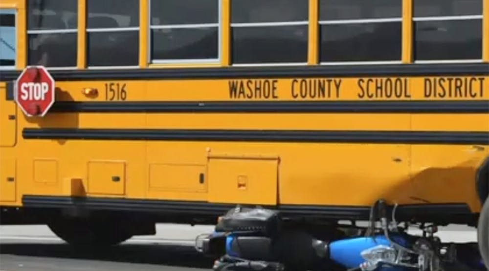 A motorcycle ended up under a school bus after a fatal accident in Sparks, Nev.