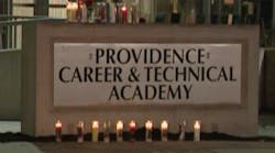 Candles outside the Providence Career and Technical Academy mourn the shooting death of a 15-year-old student.