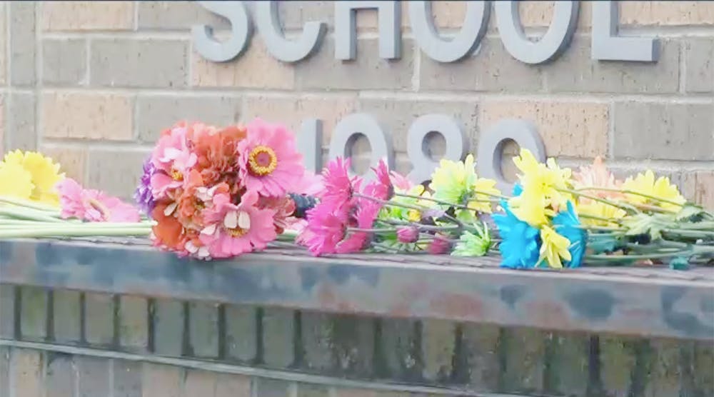 Mourners placed flowers outside Benton Elementary in memory of kindergarten teacher Angel Hayes.