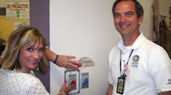 Columbia Elementary School Principal Tiffany Gomez and Technology Support Services Director Jeff Harris test the one-touch button feature, which was installed this month in all Las Cruces (N.M.) Public Schools.