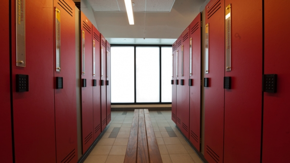 Translucent glass in the menrsquos and womenrsquos team locker rooms provides daylighting within and symmetry when viewed from the pool deck