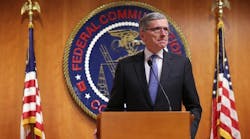 WASHINGTON, DC - Federal Communications Commission (FCC) Chairman Tom Wheeler listens during a news conference after an open meeting to receive public comment on proposed open Internet notice of proposed rulemaking and spectrum auctions May 15, 2014 at the FCC headquarters in Washington, DC.