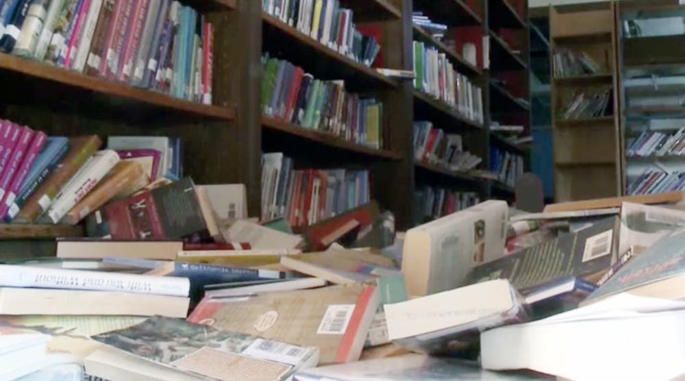 Books are strewn on the floor of the earthquake-damaged Houston Middle School.