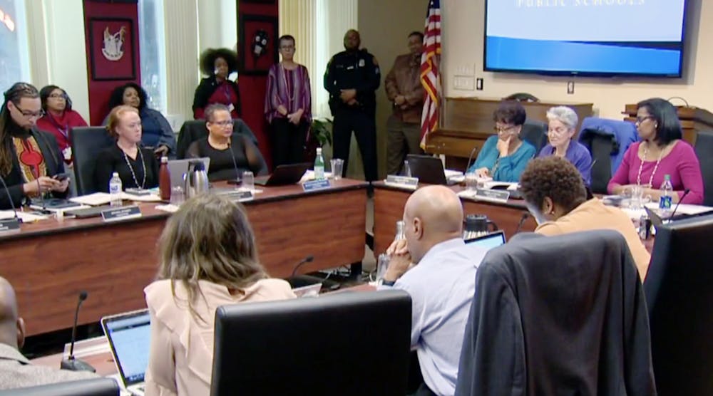 Baltimore city school board discusses whether school police should be allowed to carry guns.