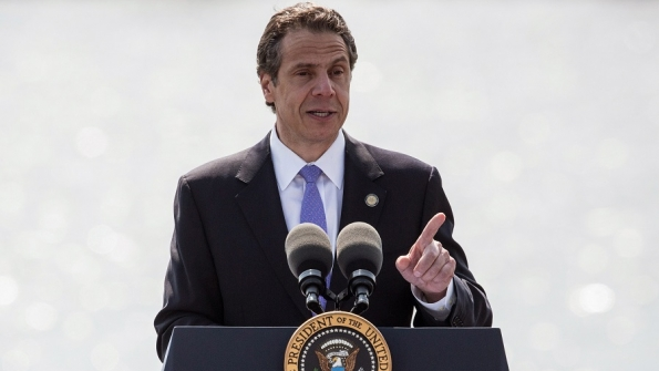 TARRYTOWN NY New York Governor Andrew Cuomo introduces US President Barack Obama at the Washington Irving Boat Club on May 14 2014 in Tarrytown New York
