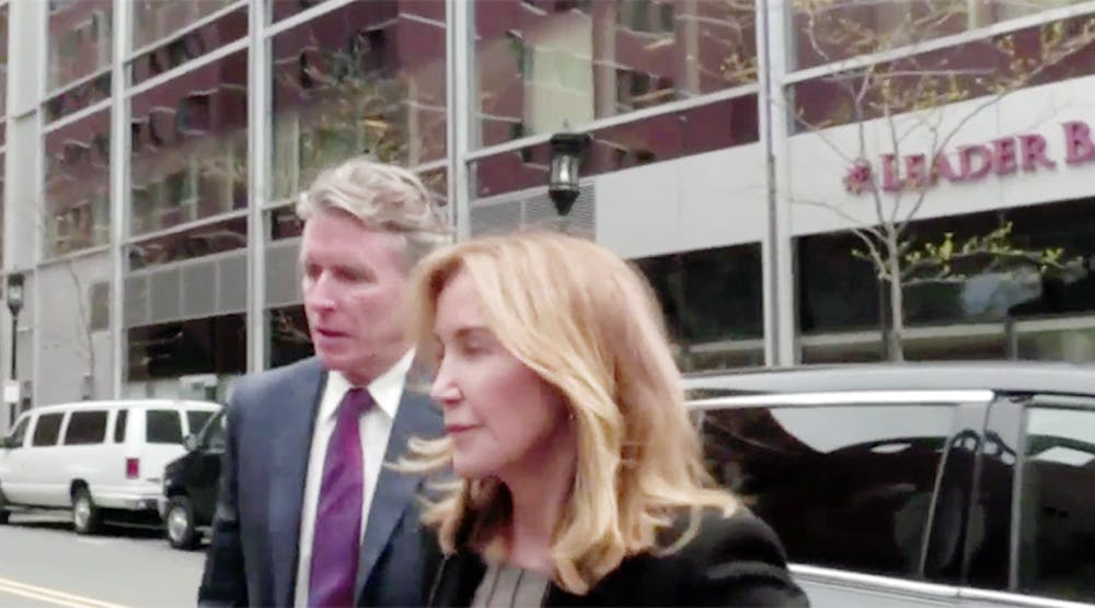 Actress Felicity Huffman arrives at the federal courthouse in Boston to enter a guilty plea.