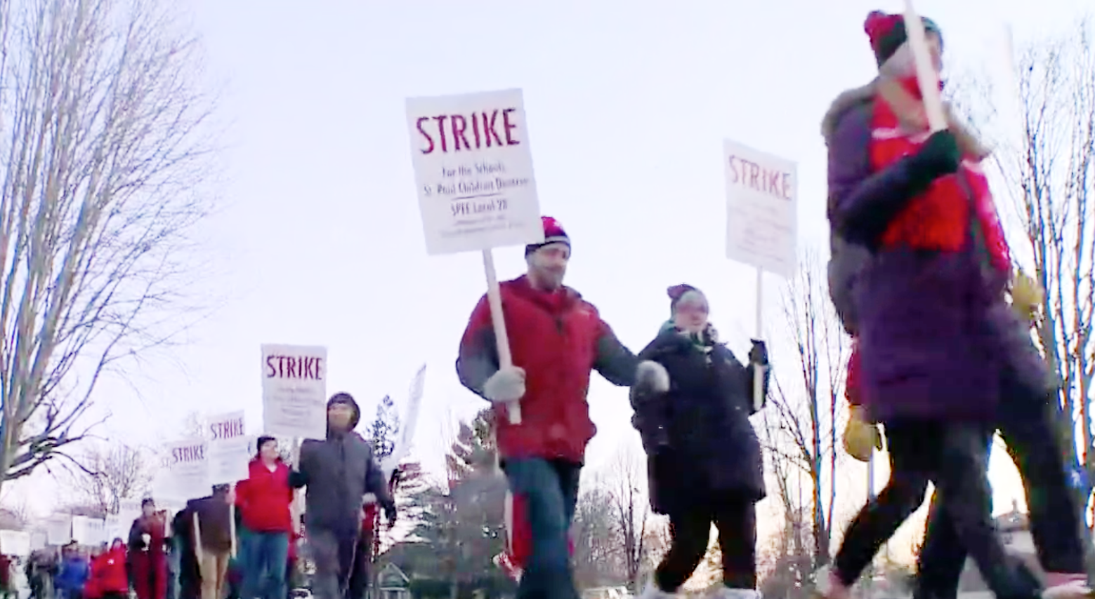 Teachers on strike in St. Paul, Minn., walk the picket line.