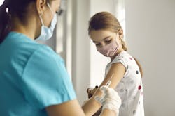 Young girl receiving her vaccine Young girl receiving her vaccine