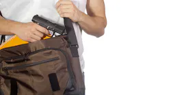 Teacher carrying gun