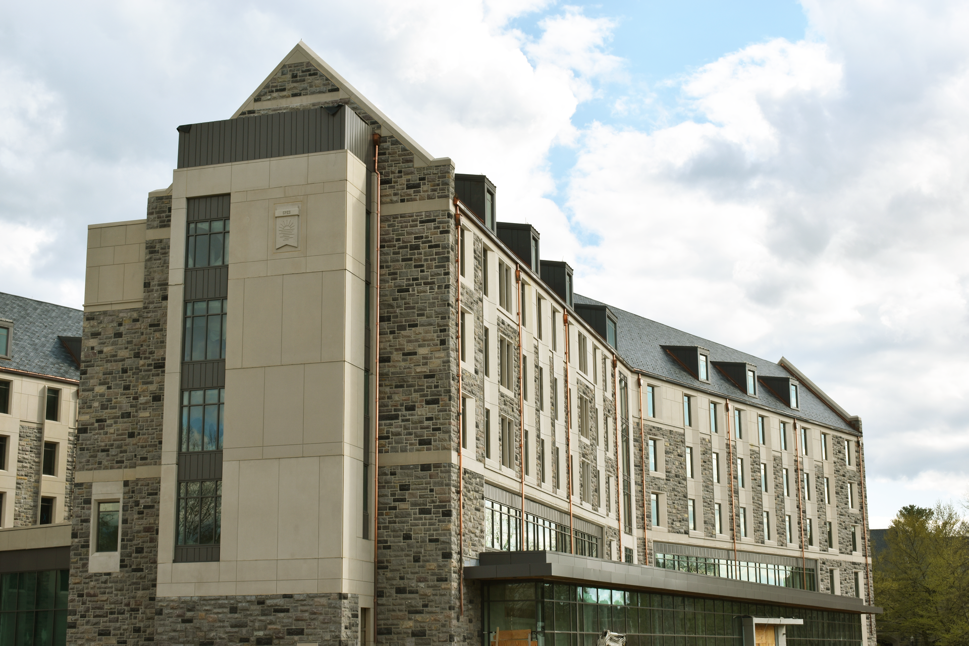 The site for the Creativity and Innovation District Residence Hall had many challenging features, including its proximity to other buildings, a steep slope, underground utilities and an existing box culvert.