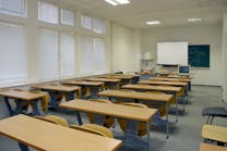 Some desks in classrooms are empty because student enrollment in public elementary and secondary schools has dropped by more than 1 million.