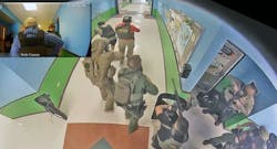 Officers advancing through a hallway at Robb Elementary School in Uvalde after shots were fired. Officers advancing through a hallway at Robb Elementary School in Uvalde after shots were fired.