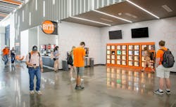 Students at Oklahoma State University's Central Marketplace wait for the food they have ordered to be placed in smart food lockers. Students at Oklahoma State University's Central Marketplace wait for the food they have ordered to be placed in smart food lockers.