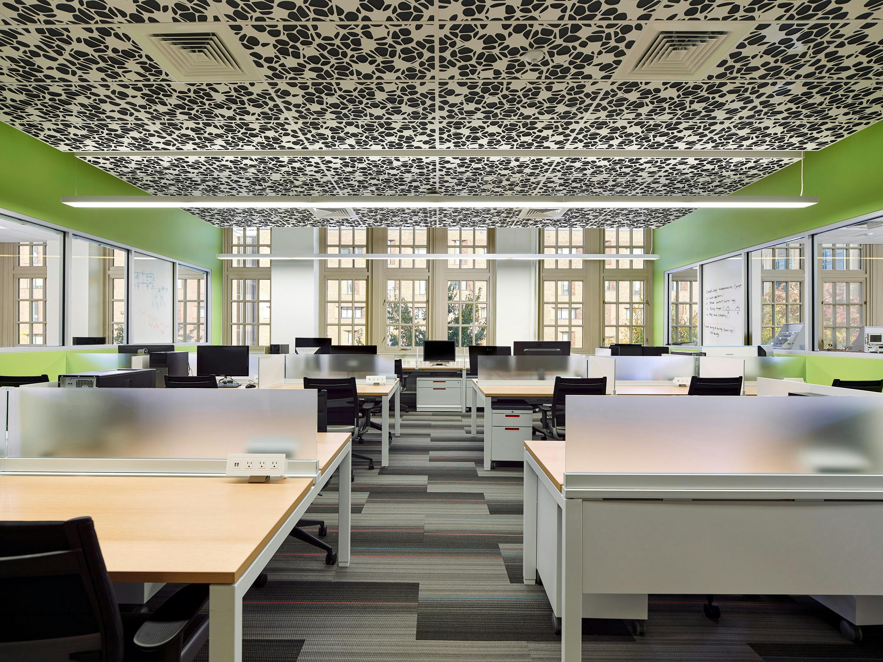 For the University of Pennsylvania Electrical and Systems Engineering Department, an outdated warren of offices was modified into open and efficient lab space. A dynamic perforated metal ceiling system provides acoustical absorption and visual interest.