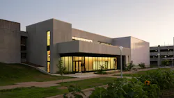 Exterior view of Missouri State University’s Construction Education Success Center addition to Kemper Hall at dusk.