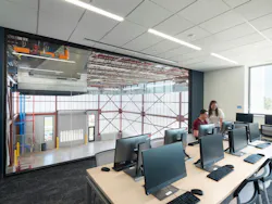 A classroom overlooks the center’s double-height training lab, where students can gain experience with full-scale construction activities.