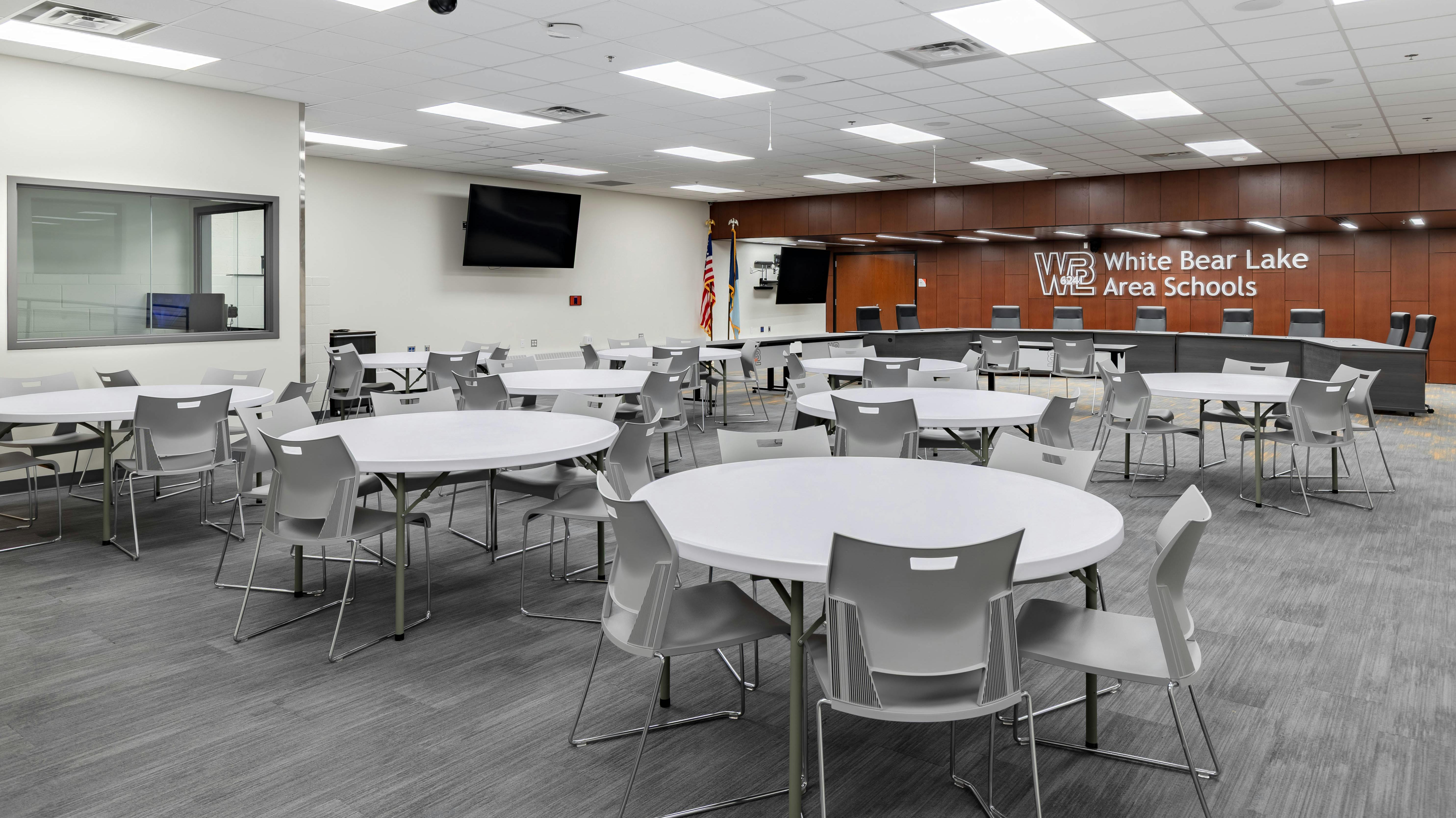 School district meeting facility with tables and seating.