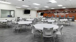 School district meeting facility with tables and seating.