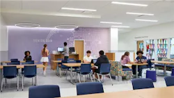 Alexandria City High School Minnie Howard classroom with grouped student workstations and casual seating arrangements
