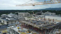 Active construction site at Virginia Tech with large crane overhead.