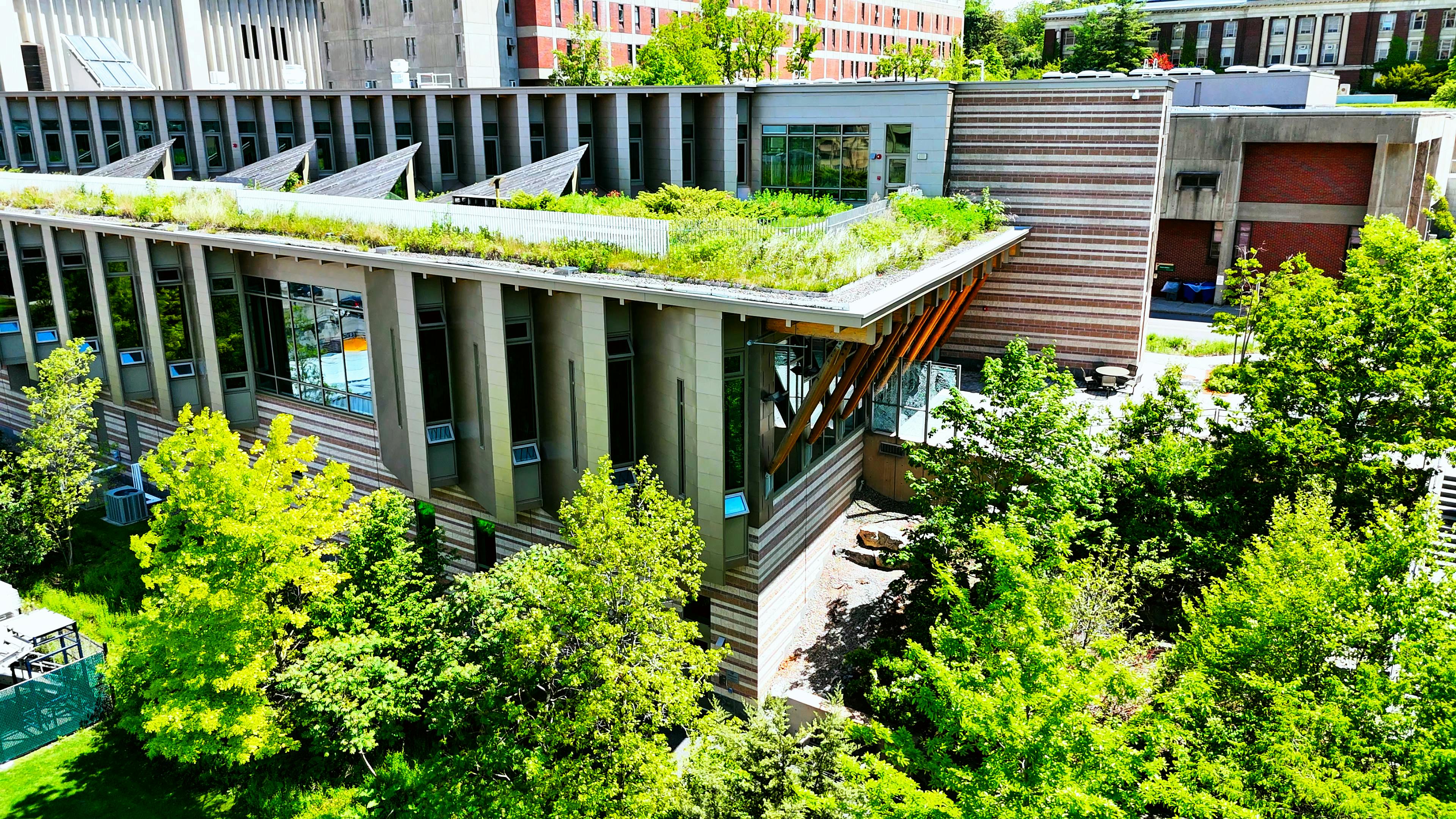 Aerial view of ducational building located on a state campus that boasts an exceptional design in sustainability and a rooftop garden that can be occupied by personnel.