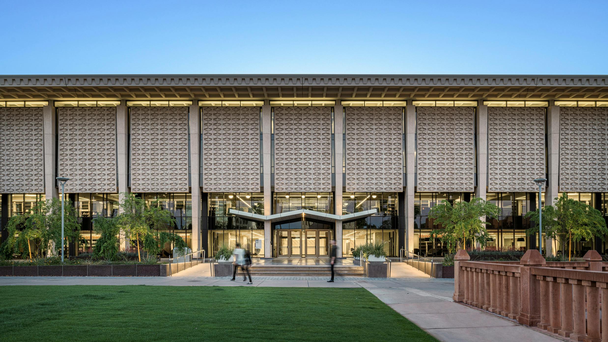 Cover image of new campus resilience report featuring exterior of college campus building.