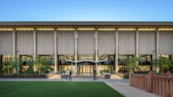 Cover image of new campus resilience report featuring exterior of college campus building.