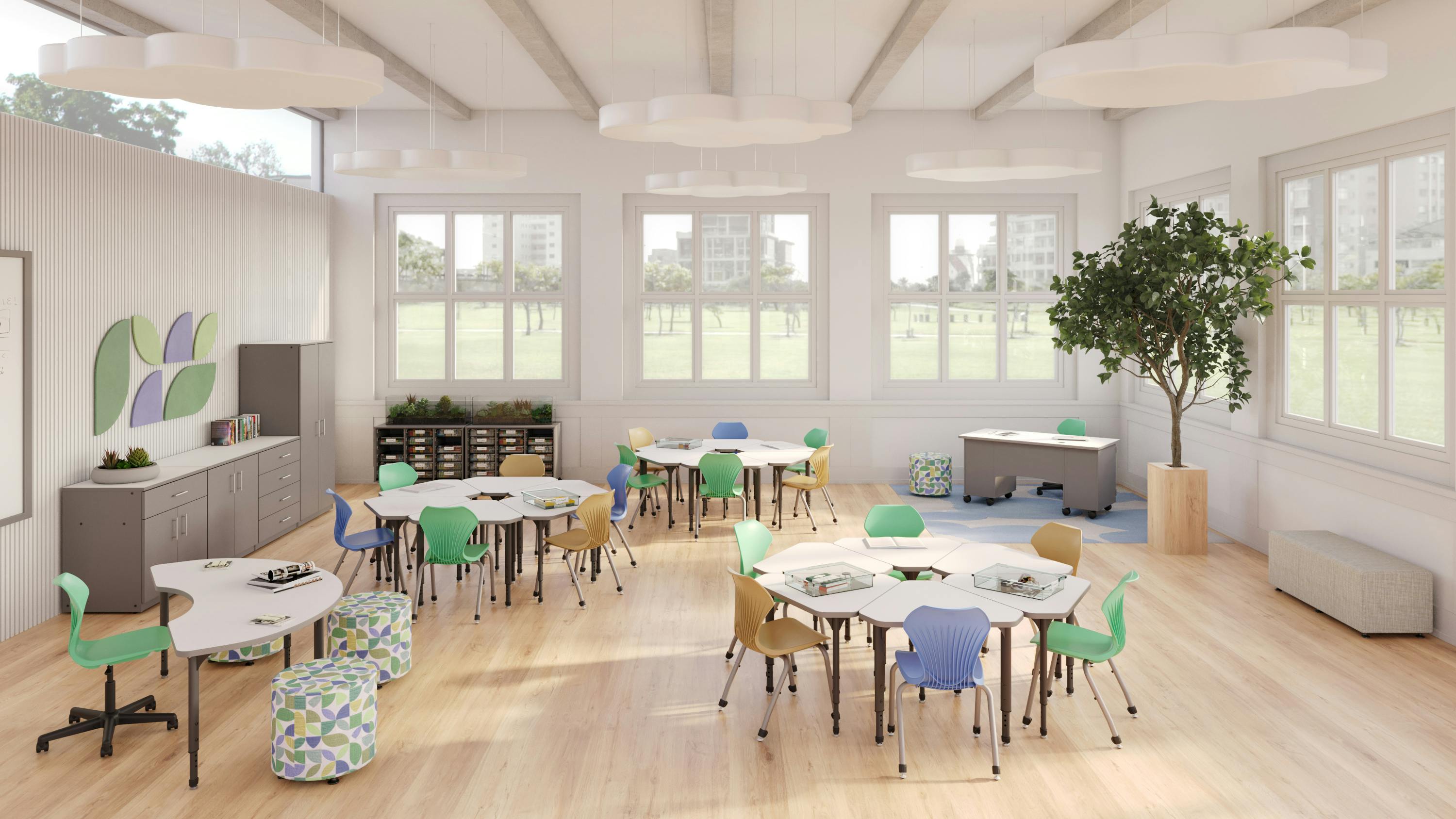 A spacious classroom configuration with trapezoidal student desks arranged in small clusters, with a curved teacher workstation, in neutral tones complemented by shades of mint green, pastel lilac, and goldenrod yellow