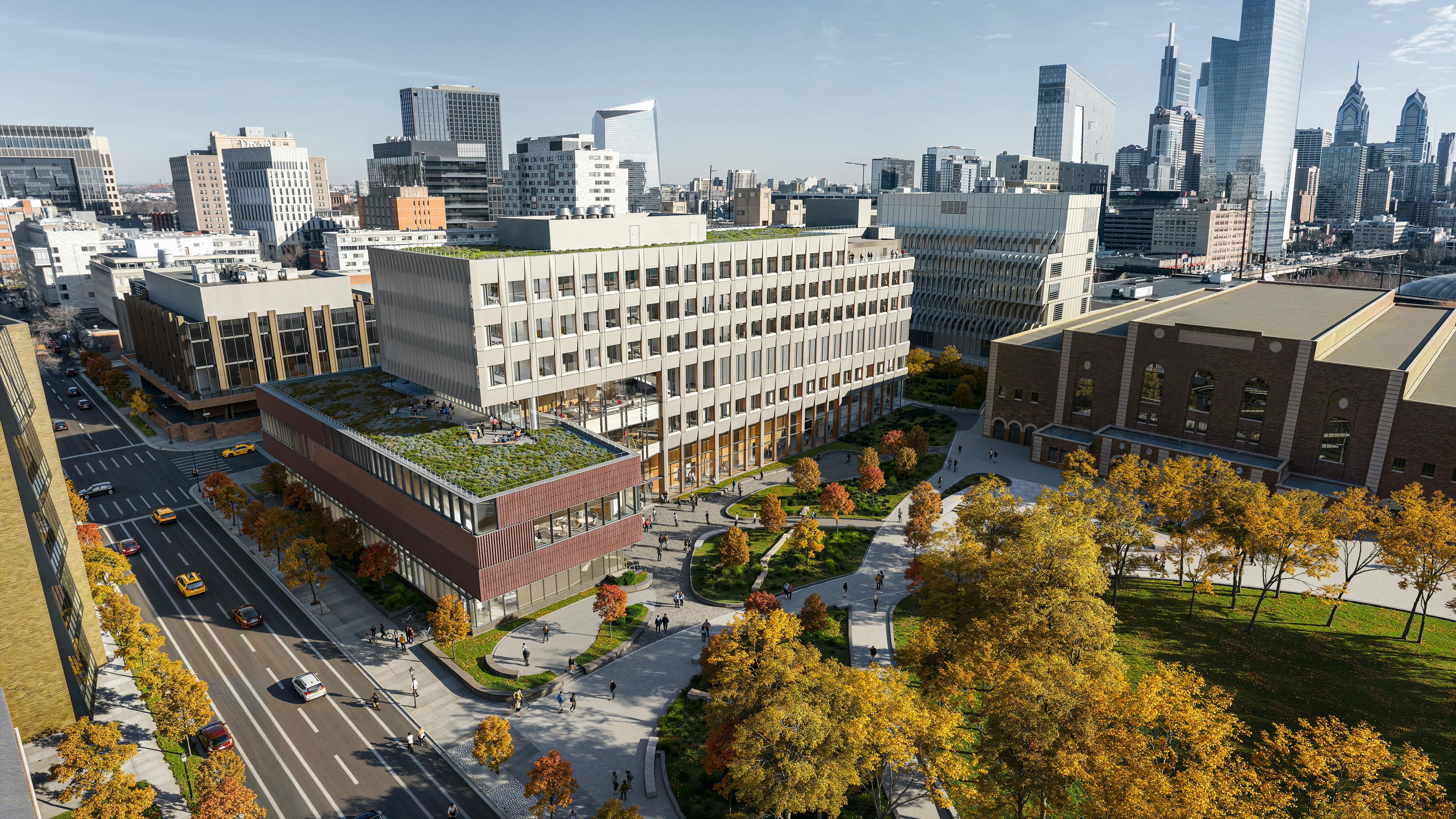 Aerial view of new physical sciences complex at University of Pennsylvania with Philadelphia skyline in background.